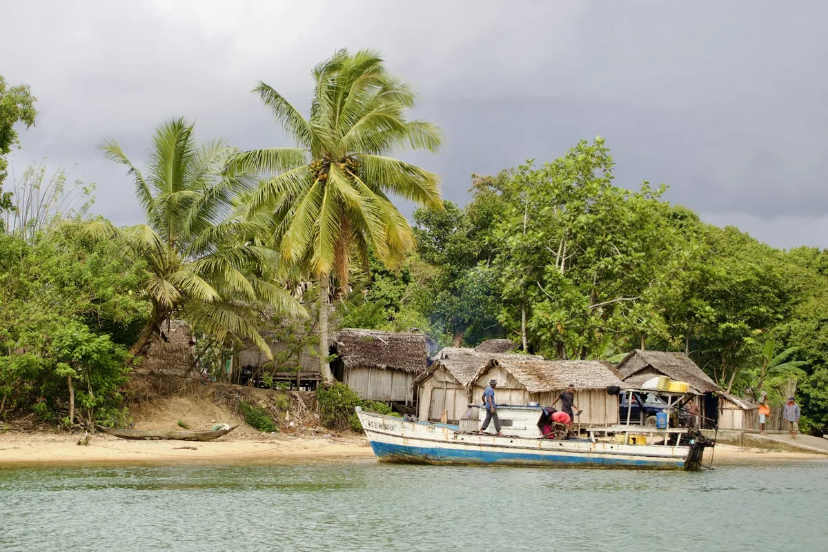 A traditional boat on the water near a coastal village on Madagascar's east coast