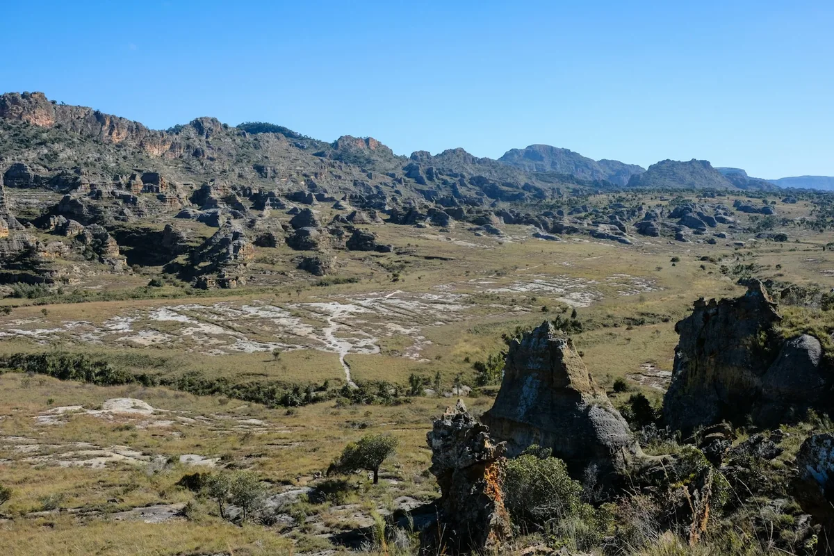 Rocky highland terrain under a blue sky in Madagascar's central plateau
