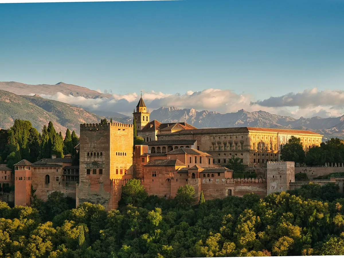 The Alhambra palace complex at sunset in Granada, Spain