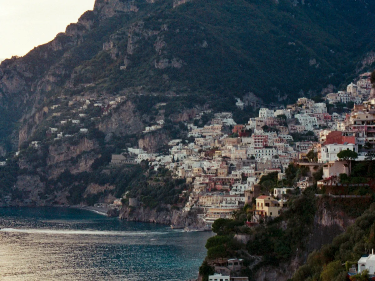 Positano's pastel houses tumbling down the cliffside toward the sea