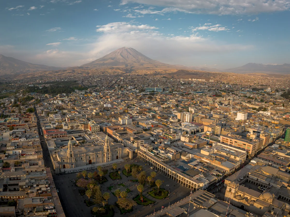 Arequipa's cathedral square with El Misti volcano behind it, Peru