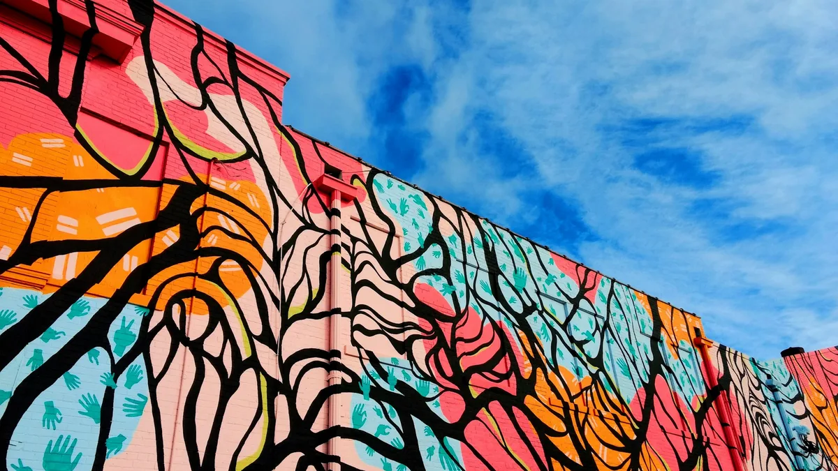 A colorful painted mural on an urban wall