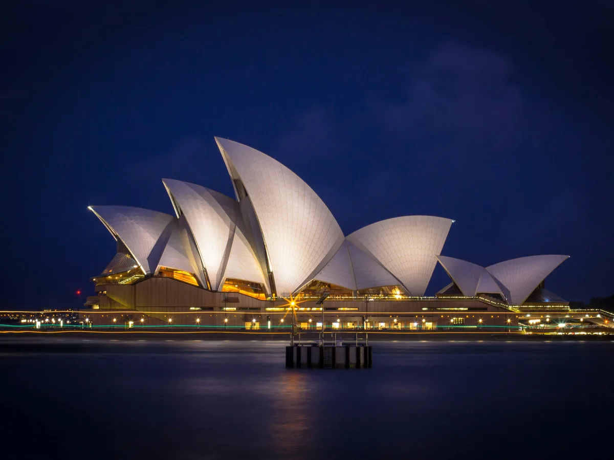 The Sydney Opera House lit up at night on Sydney Harbour