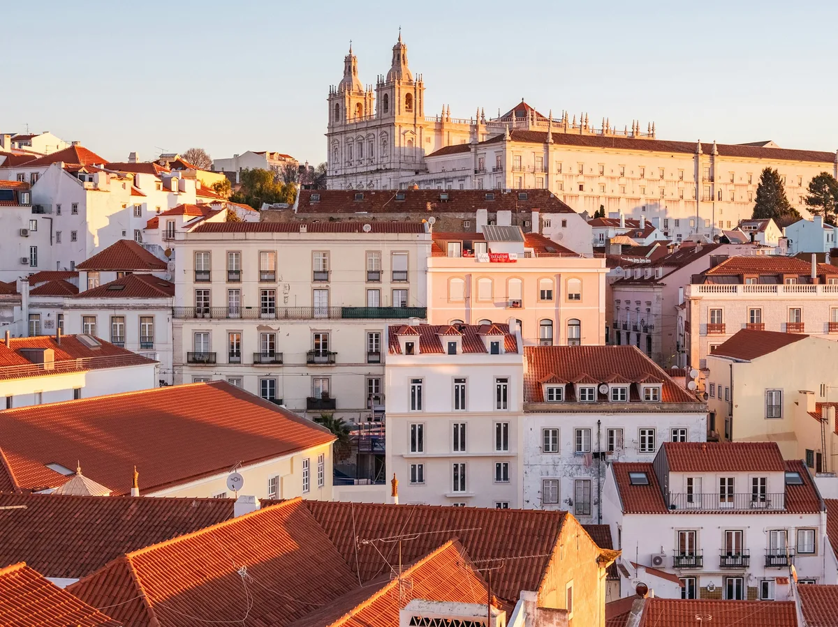 Panoramic view over Lisbon's historic hillside rooftops and streets