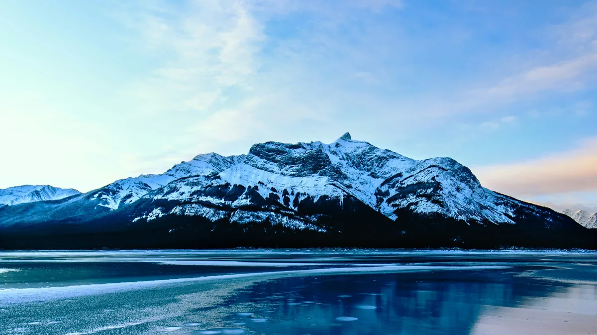 Frozen white bubbles trapped in the clear ice of a mountain lake