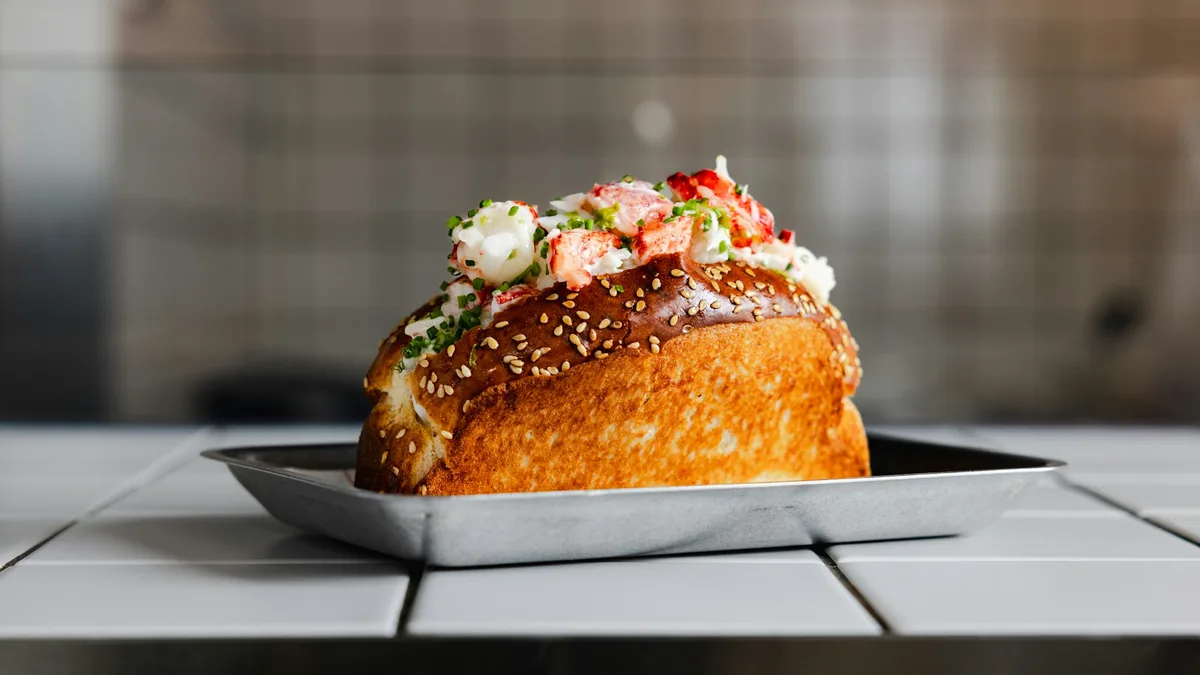 A fresh lobster roll served on a plate