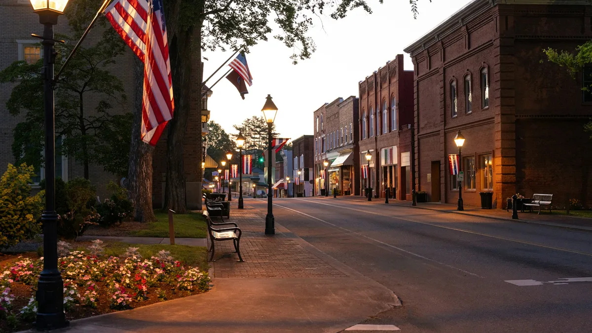A historic New England street at dusk with old buildings