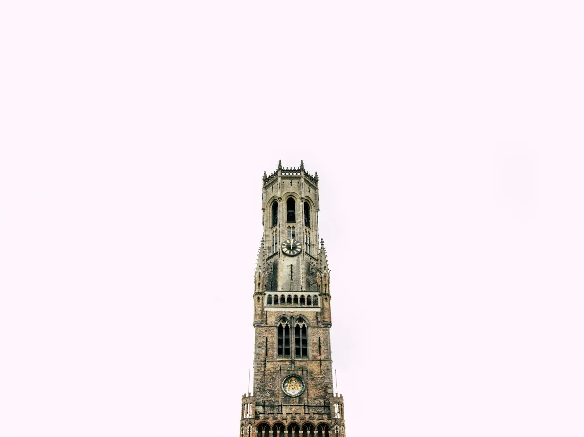 The Belfry of Bruges rising above the Markt square
