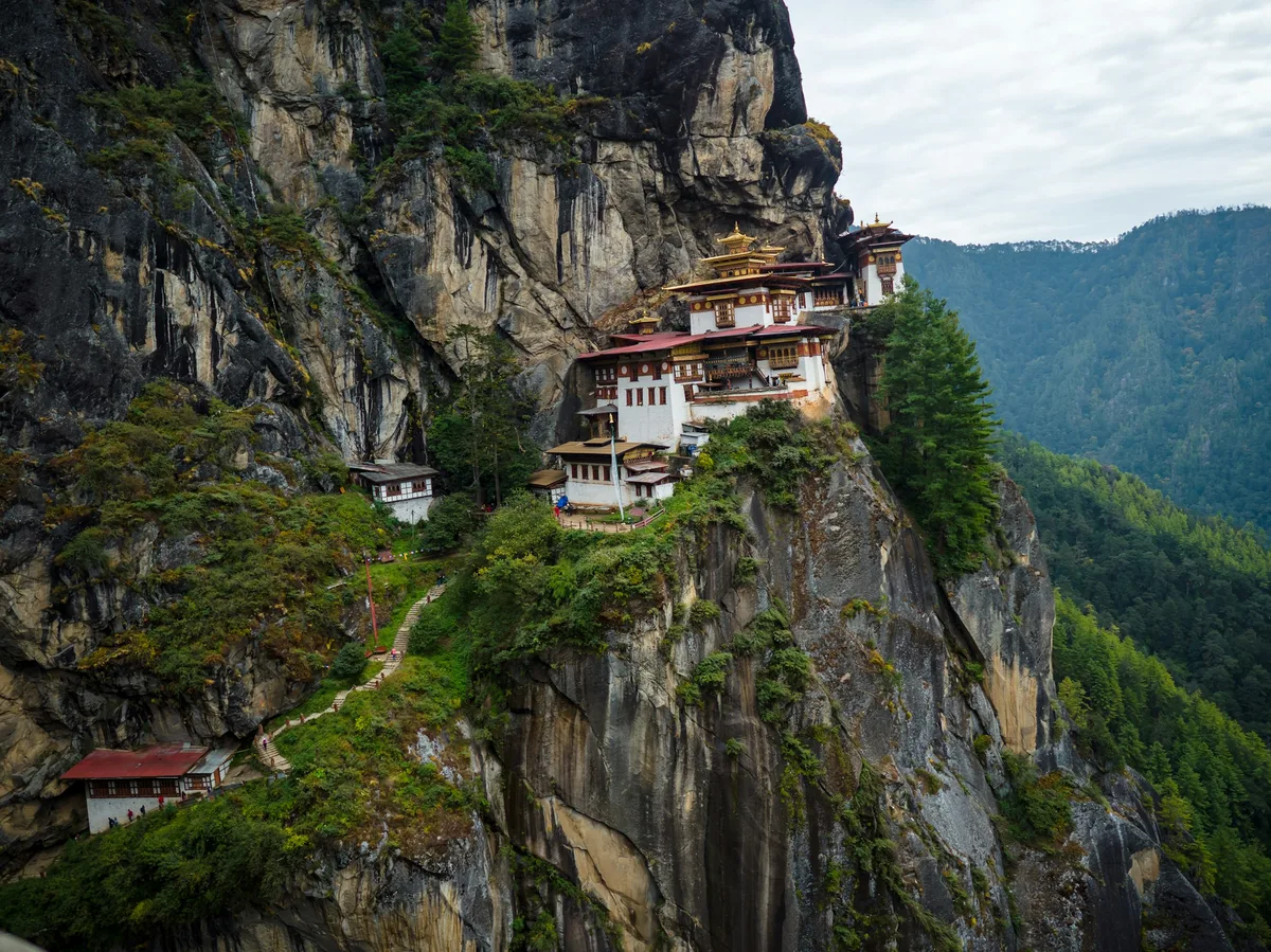 A traditional Bhutanese farmhouse on a mountainside