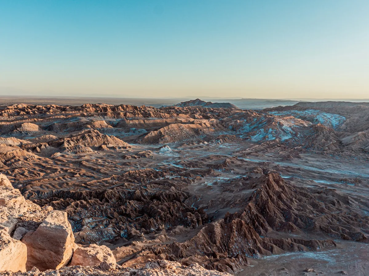 A sweeping view across a high Andean mountain range spanning Peru and Bolivia