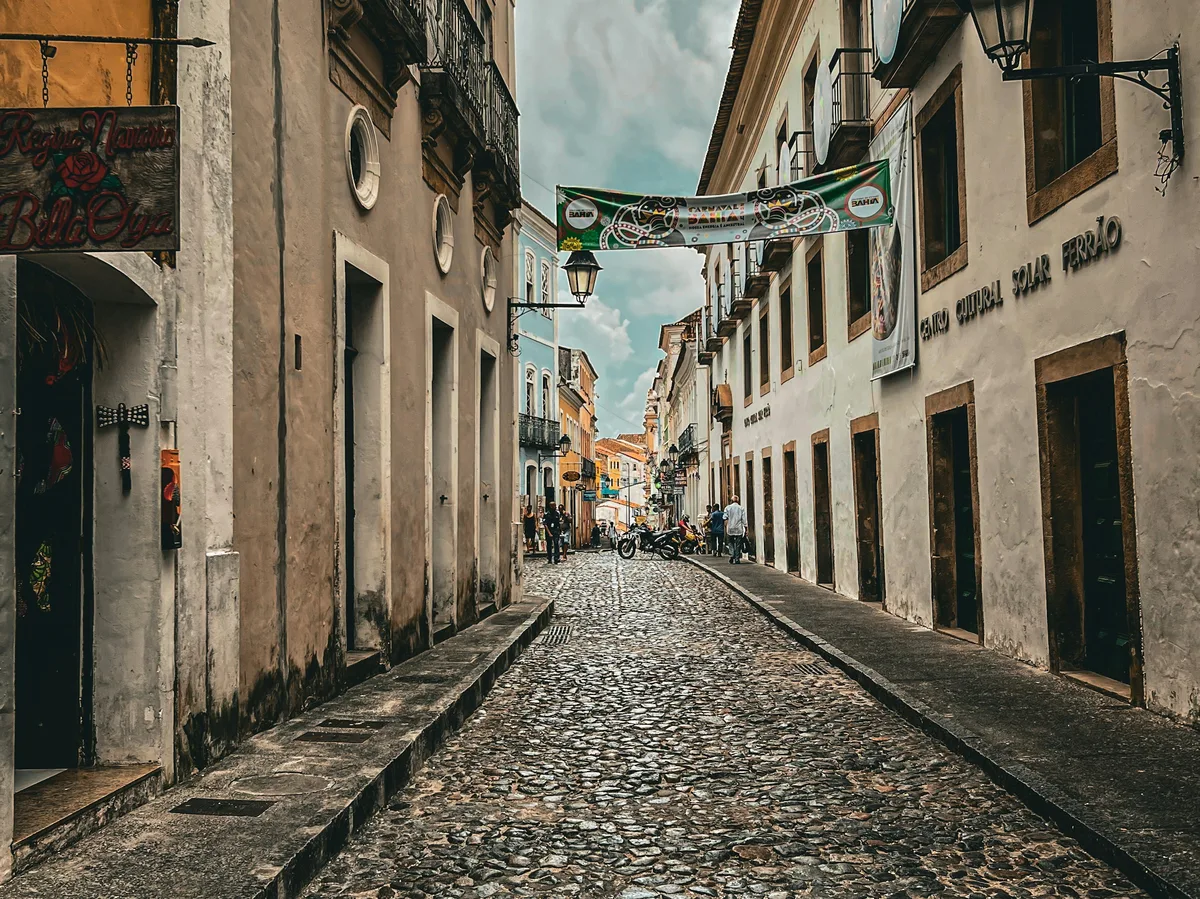 A colonial cobblestone street lined with historic buildings