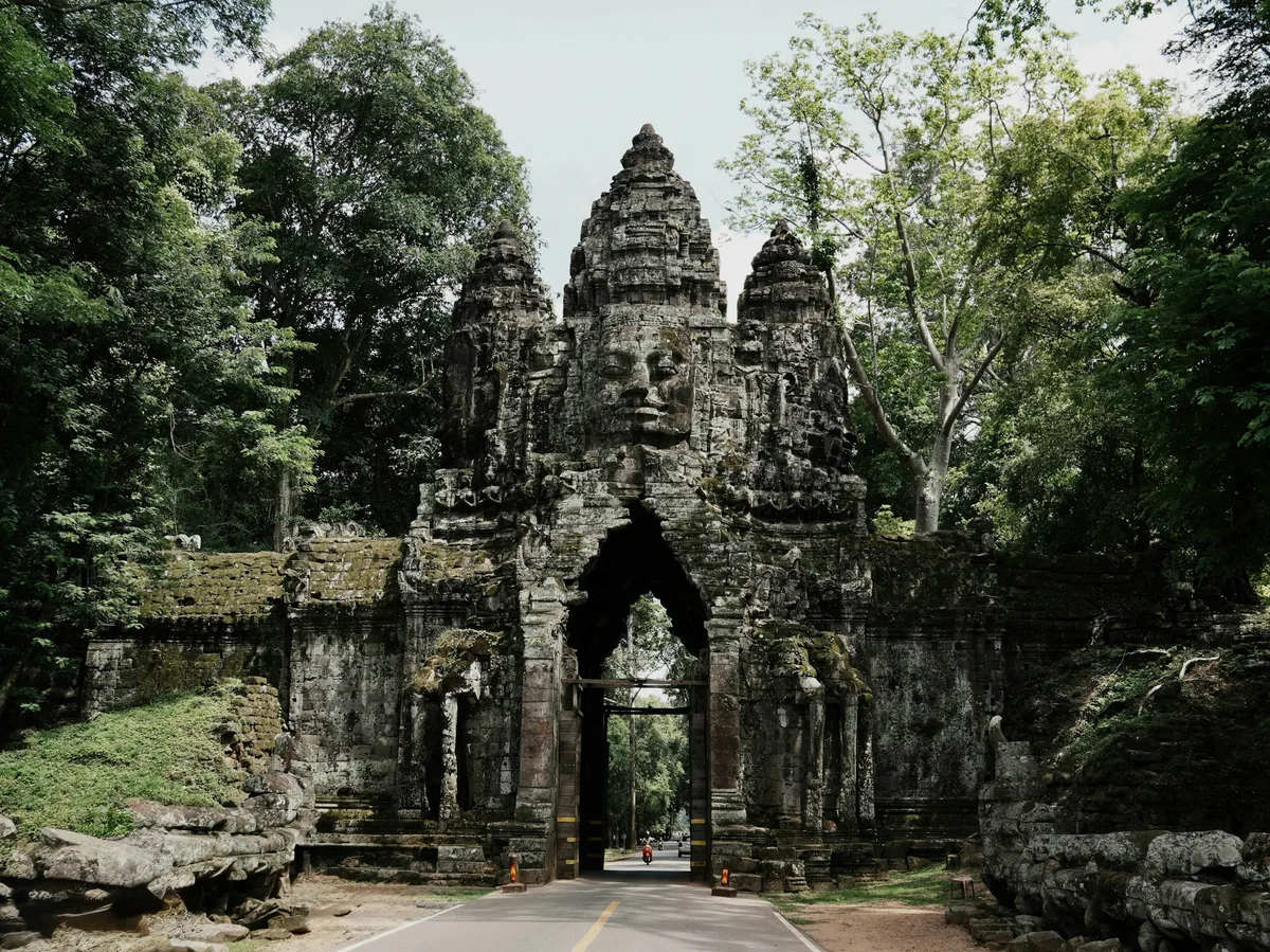 Stone gate carved with a serene Bayon face at Angkor Thom, Cambodia