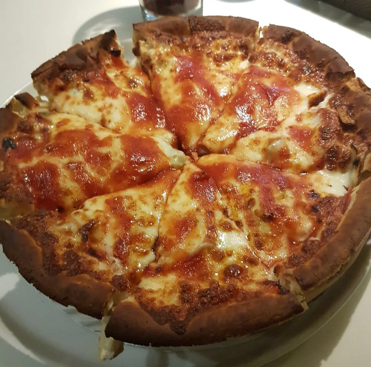 Chicago deep-dish pizza on a restaurant table