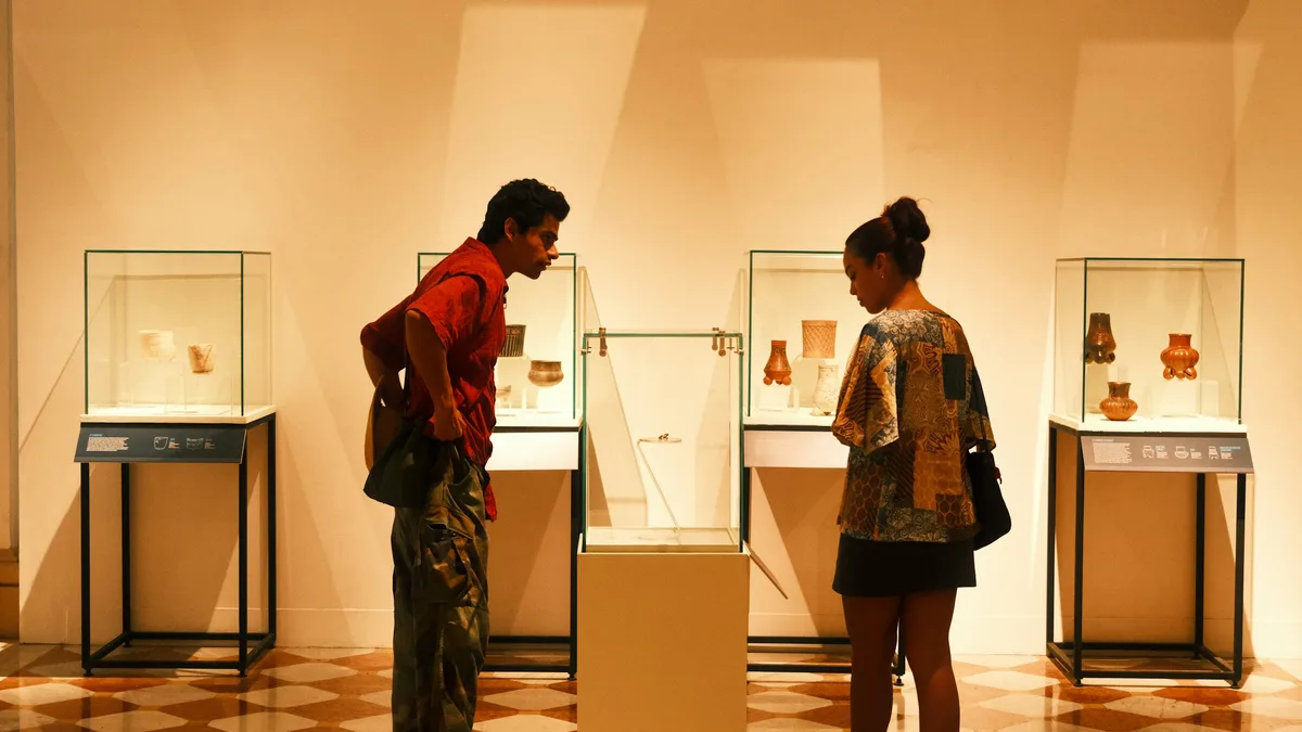 A museum exhibit hall with historic artifacts on display