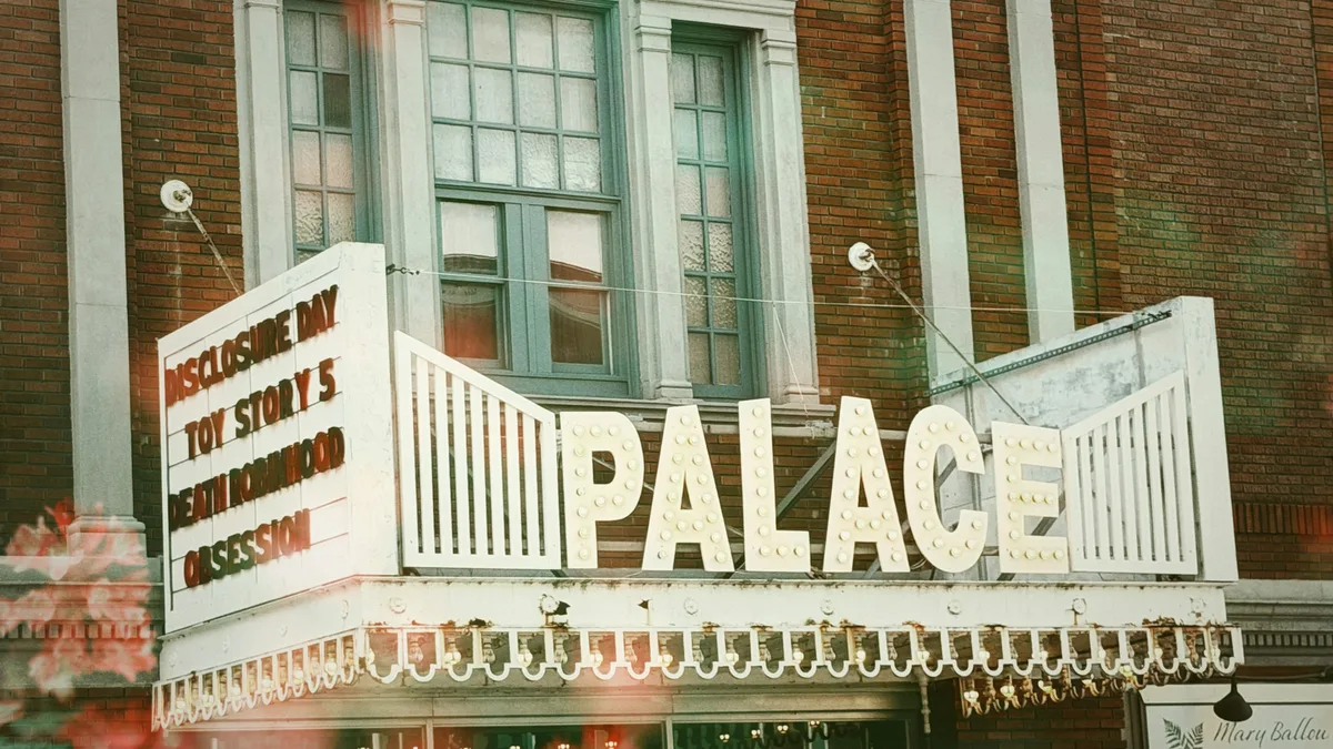 A historic downtown theater facade with marquee lights