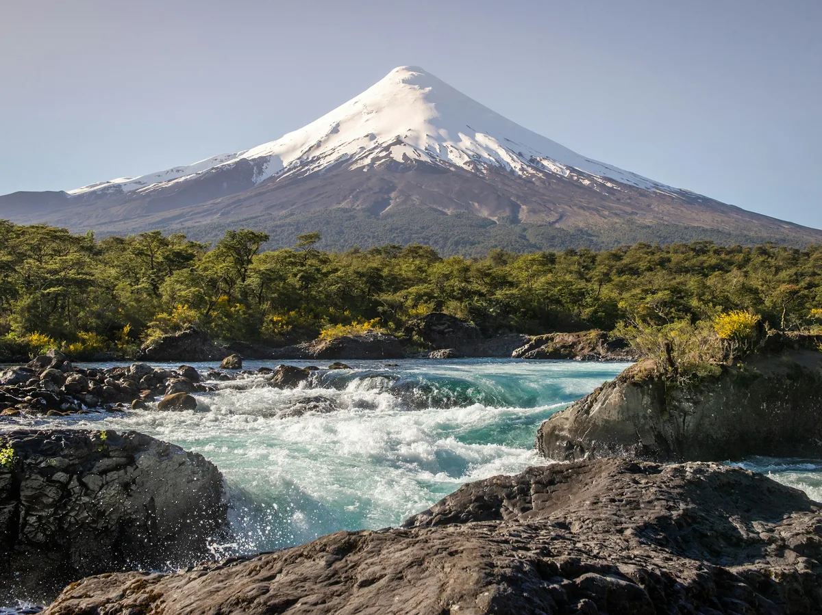 Snow-capped Osorno volcano reflected in a lake in Chile's Lake District