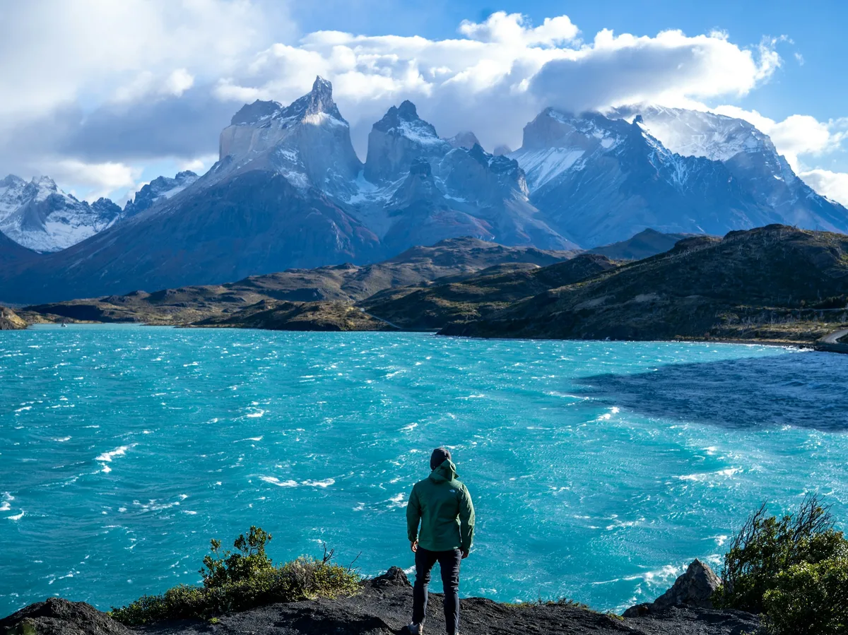 Turquoise lake beneath the granite towers of Torres del Paine at sunrise