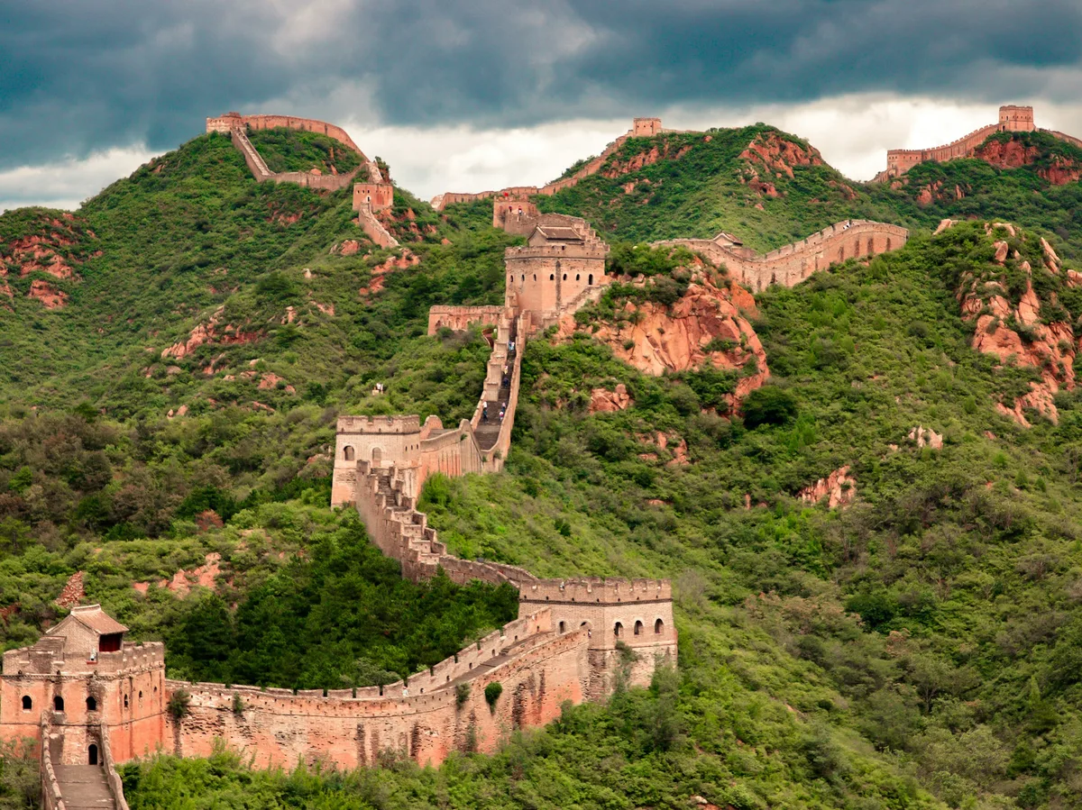 The Great Wall of China winding over green mountains near Beijing