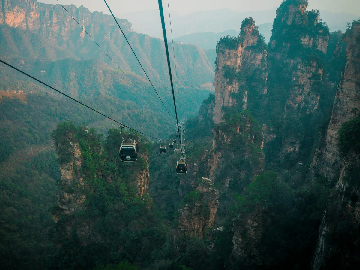 Cable cars traveling through the sandstone pillar mountains of Zhangjiajie