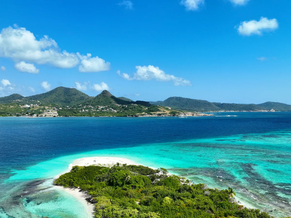Turquoise Caribbean waters lapping a white-sand beach, typical of Colombia's island coast