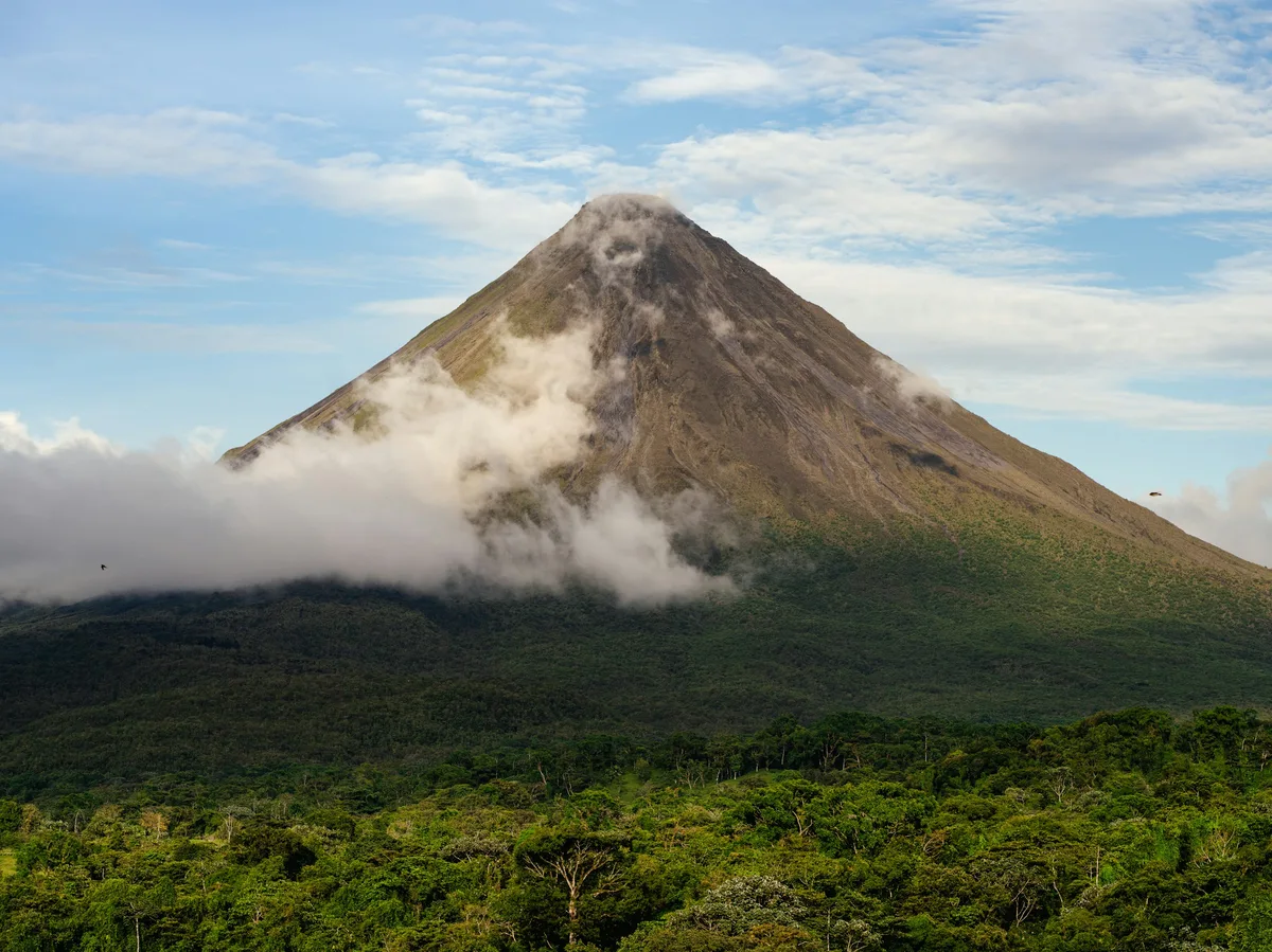 Arenal Volcano rising above the rainforest near La Fortuna, Costa Rica