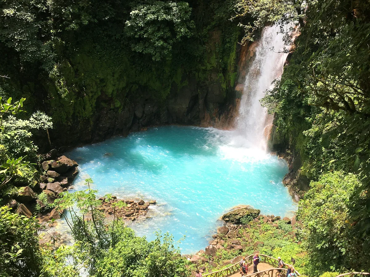 The turquoise waters of Rio Celeste cascading through the rainforest near Tenorio Volcano National Park, Costa Rica