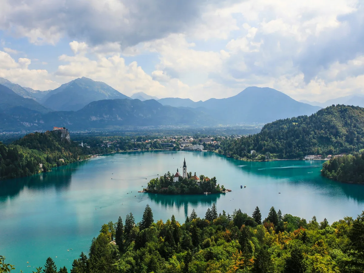 The island church on Lake Bled seen from the surrounding forested hills in Slovenia