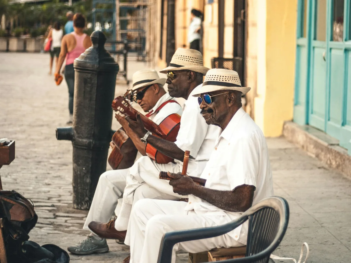 Street musicians playing guitar in Havana, Cuba