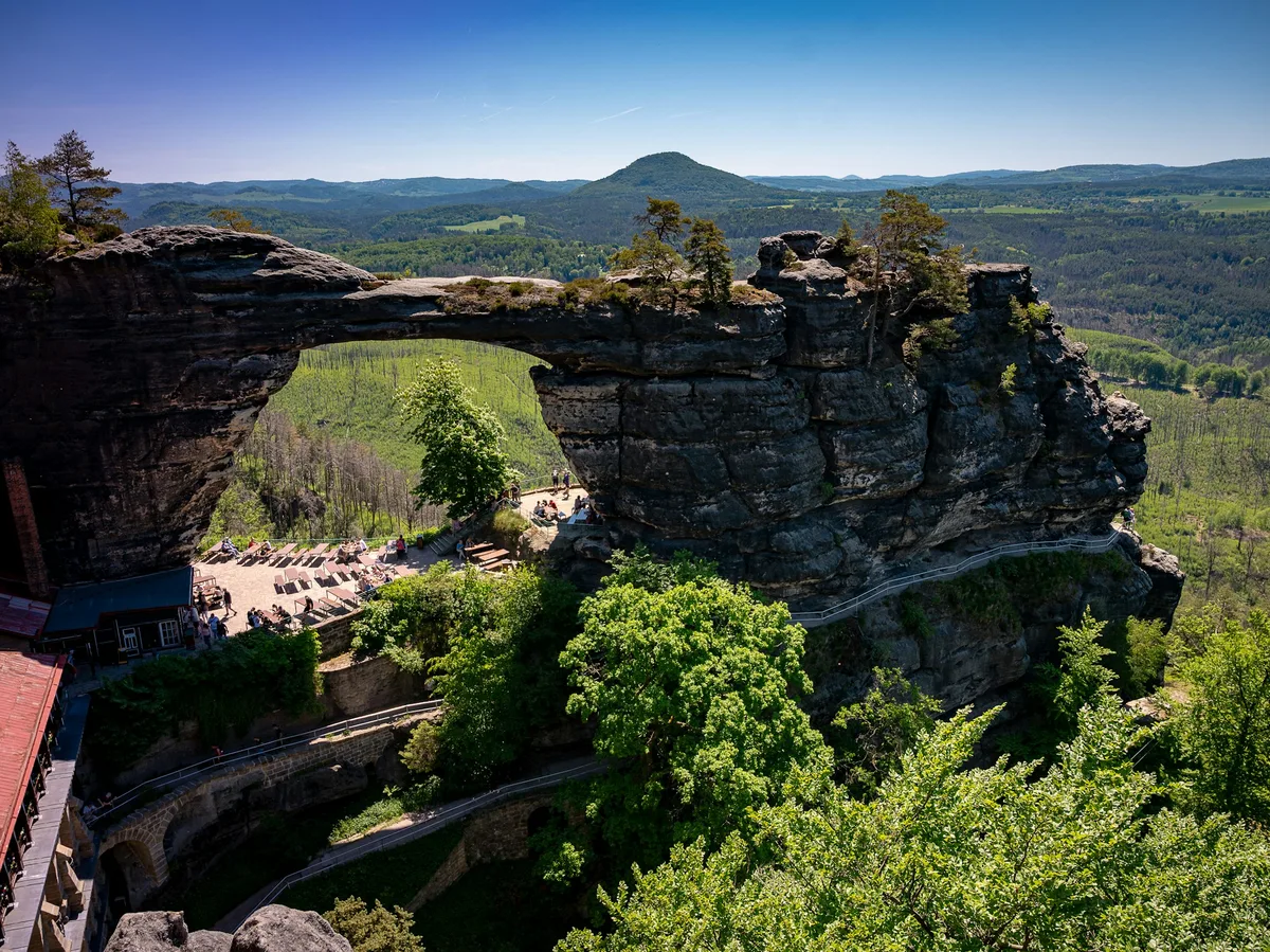 The Pravčická Brána sandstone rock arch rising above the forested hills of Bohemian Switzerland National Park