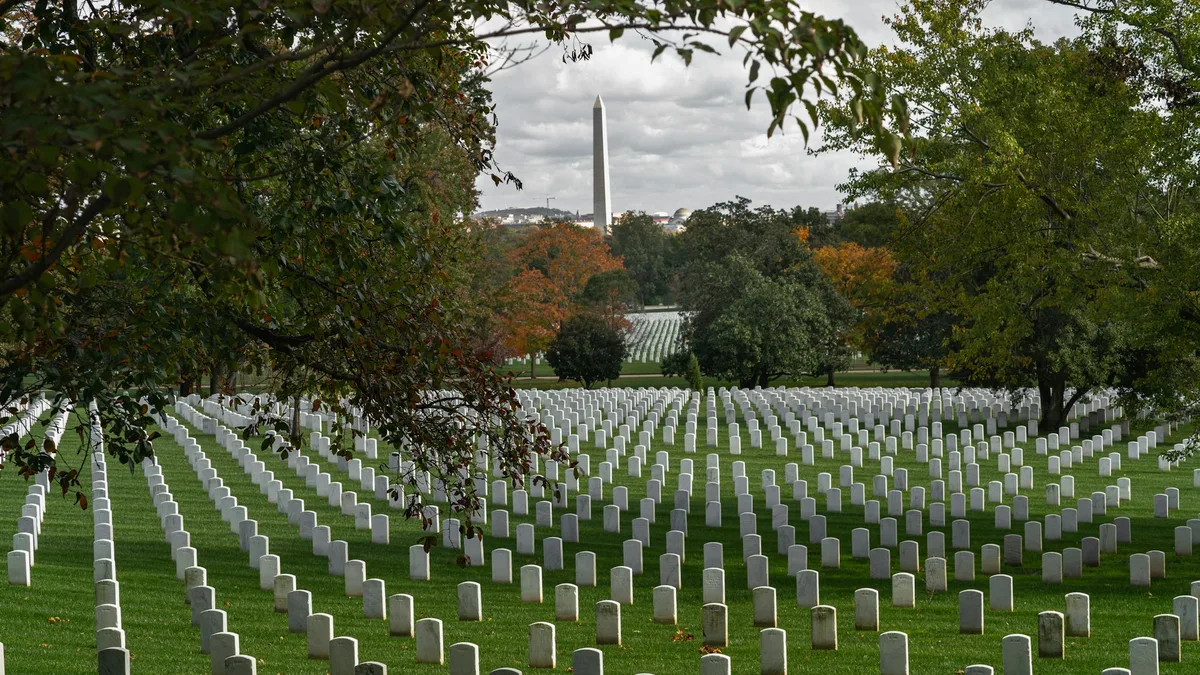 Rows of white headstones at a military cemetery