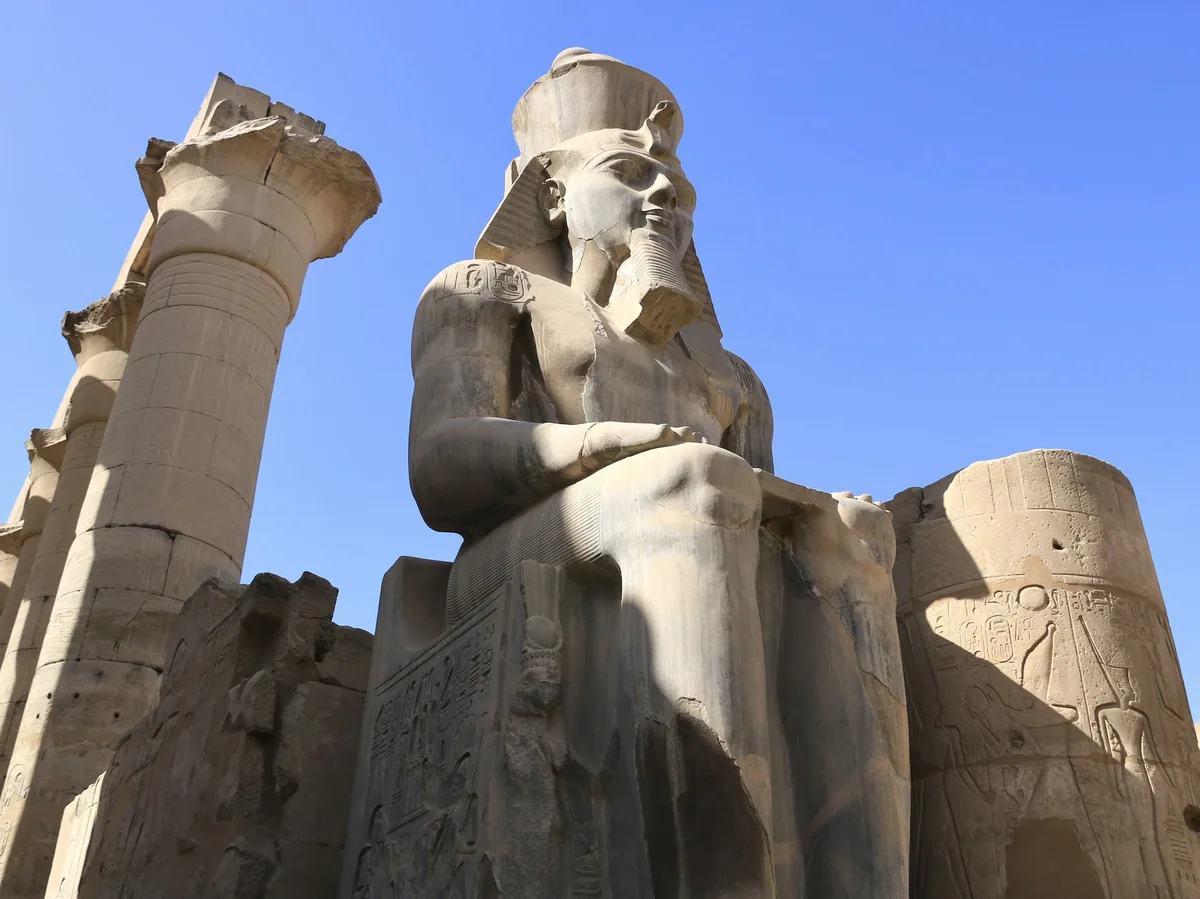 Columns of the Luxor Temple illuminated at dusk