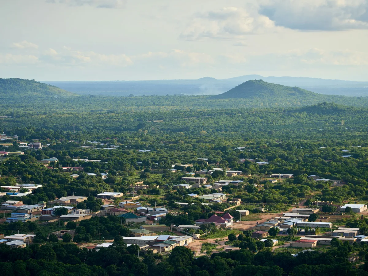 A small town nestled among green hills in Ghana's Volta Region