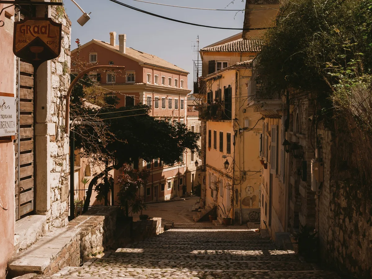 A cobblestone street in Corfu's historic Old Town, Greece