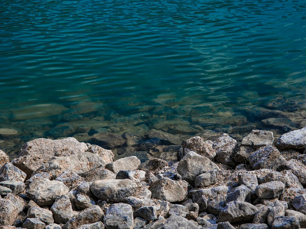 Emerald-green waters of a lake in the Hatta mountains, UAE