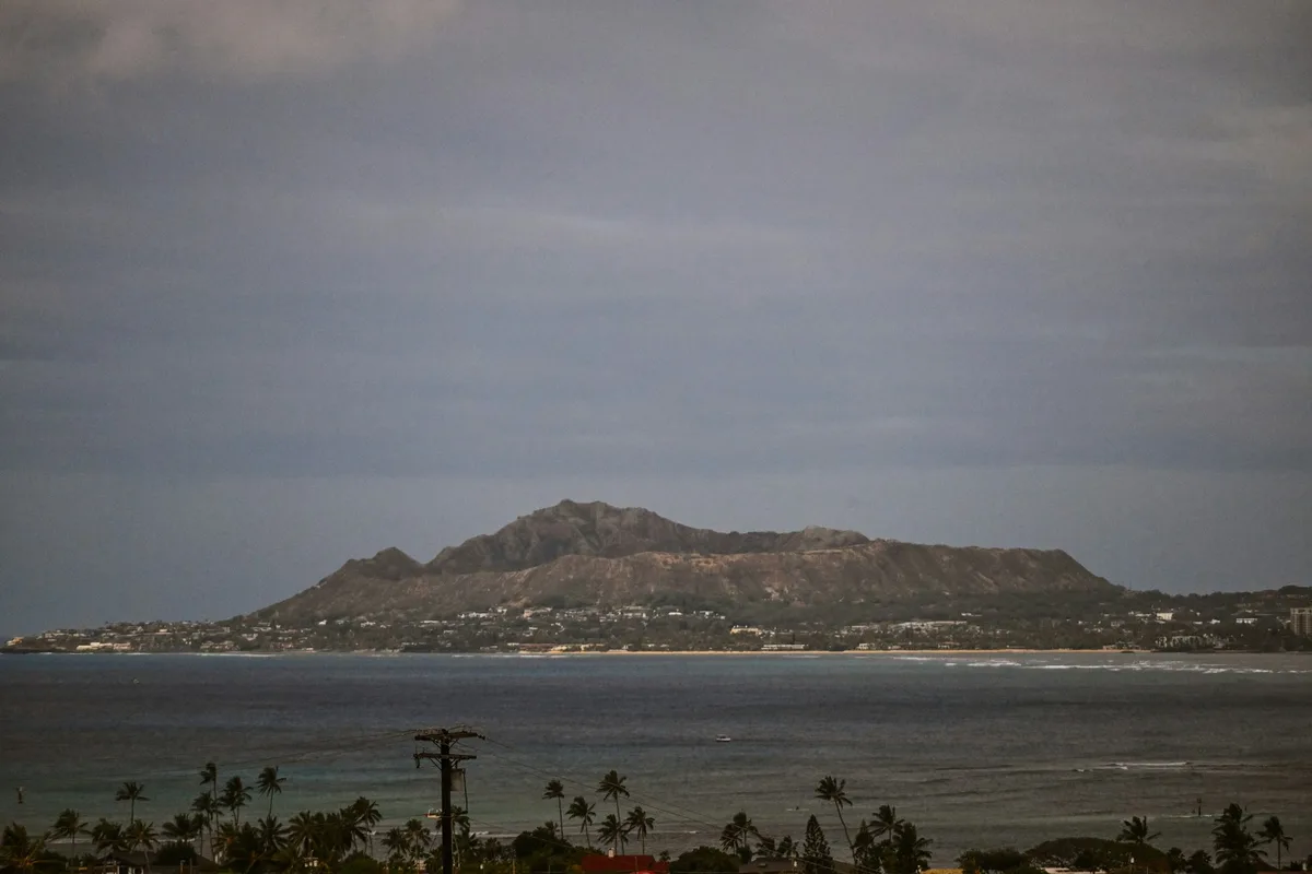 The Diamond Head volcanic crater rising above the Oahu coastline