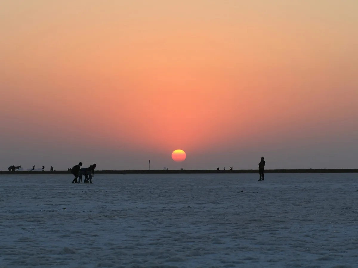 The white salt flats of the Rann of Kutch at sunset
