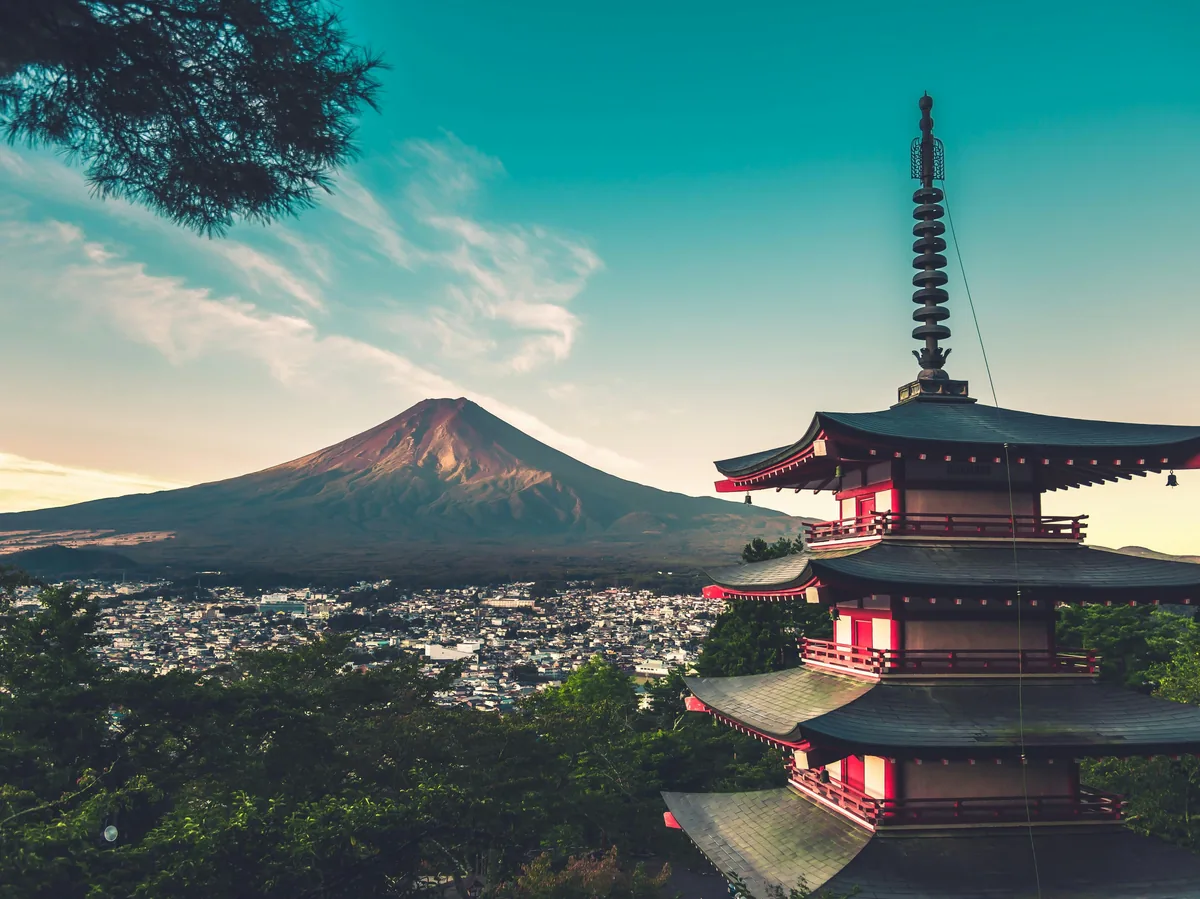 The red Chureito Pagoda framed against snow-capped Mount Fuji in Fujinomiya, Japan