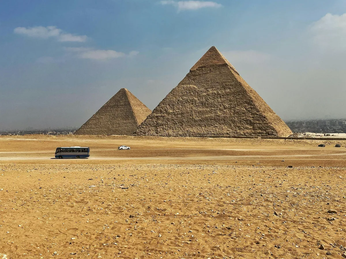 The Great Pyramids of Giza rising from the desert outside Cairo, Egypt