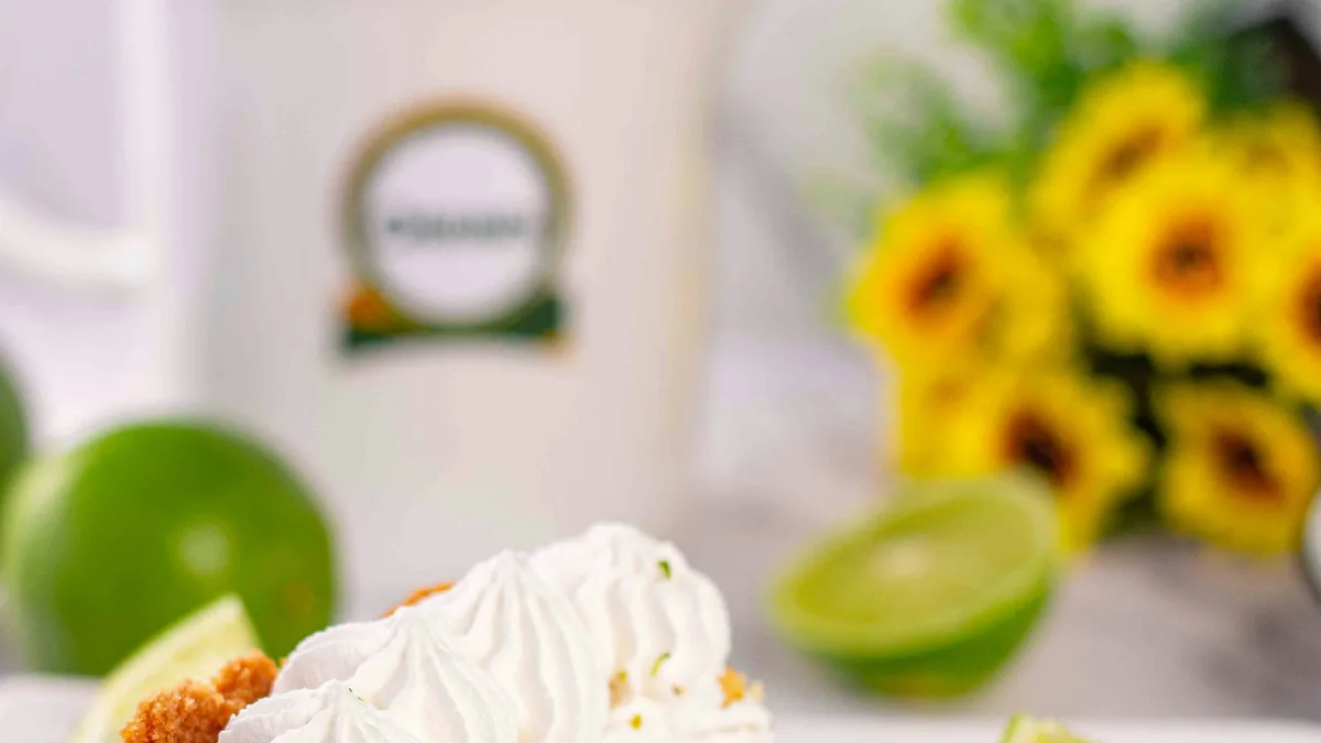 A slice of key lime pie on a plate