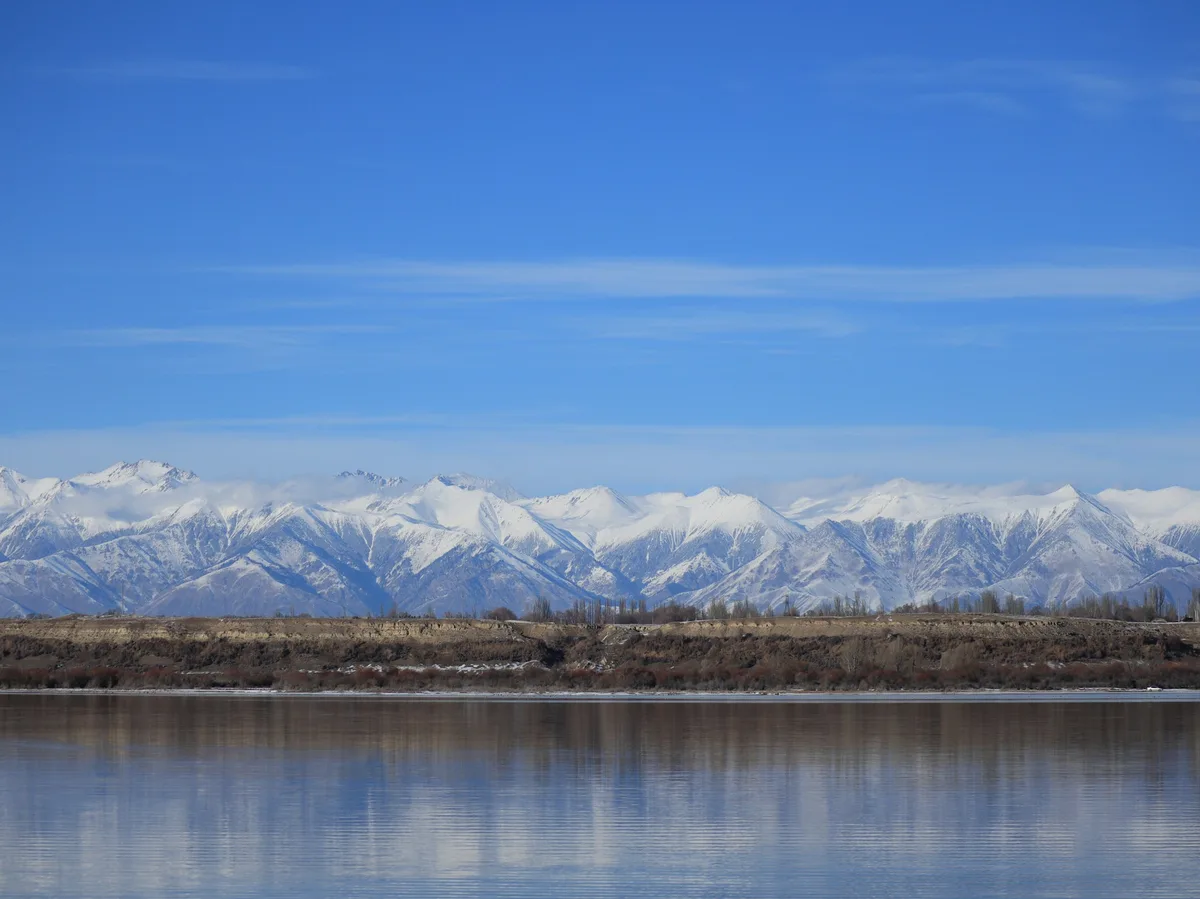 Issyk-Kul Lake in Kyrgyzstan, seen with mountains in the background