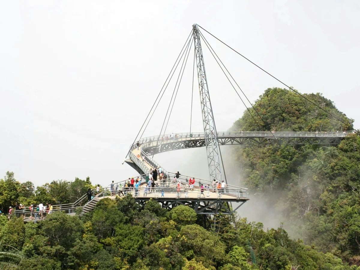 The Langkawi Sky Bridge rising above the rainforest and mountain mist in Malaysia