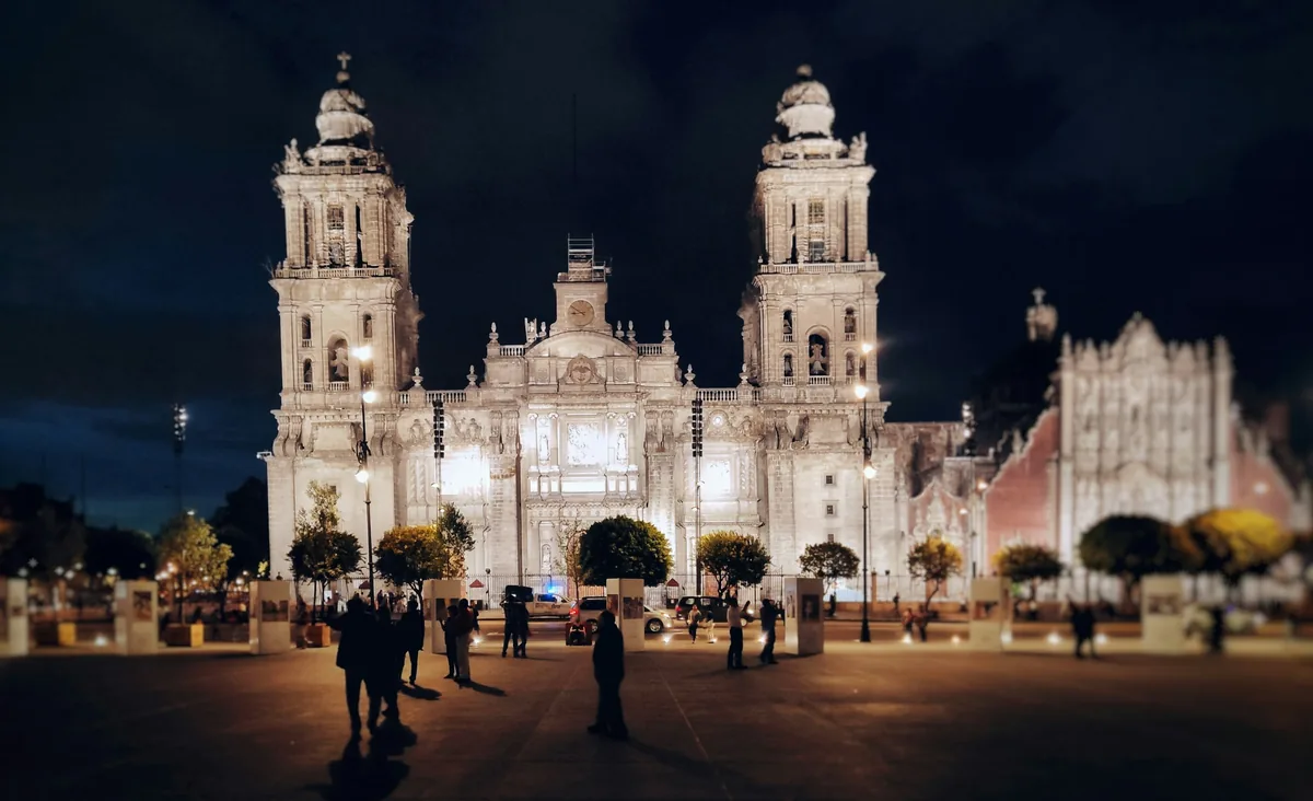 The historic center of Mexico City lit up at night near the Metropolitan Cathedral