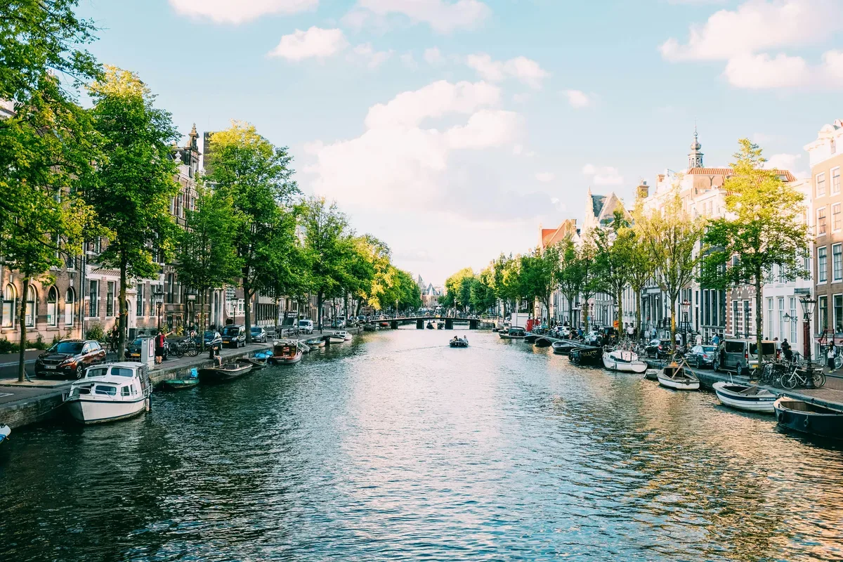 A canal in Amsterdam lined with historic gabled houses, Netherlands