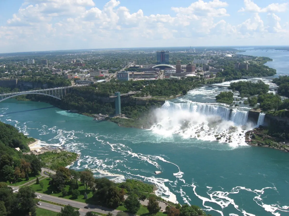 Niagara Falls seen from the American side, with mist rising over the water
