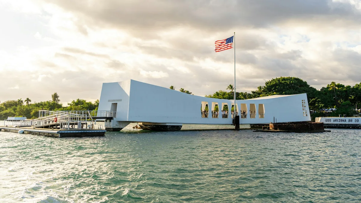 The USS Arizona Memorial structure spanning the water at Pearl Harbor