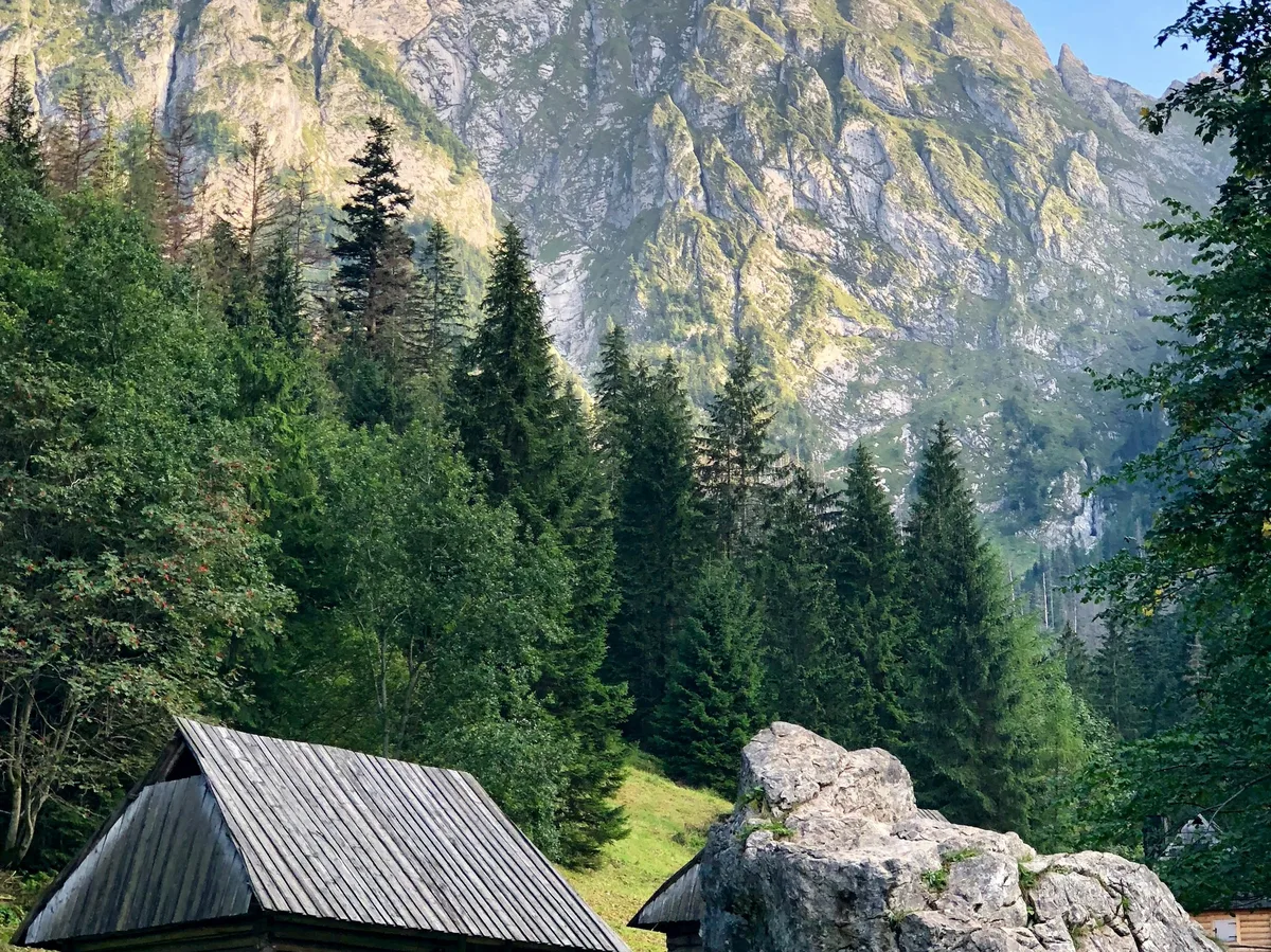 A traditional wooden mountain hut below the peaks of the Tatra Mountains near Zakopane, Poland