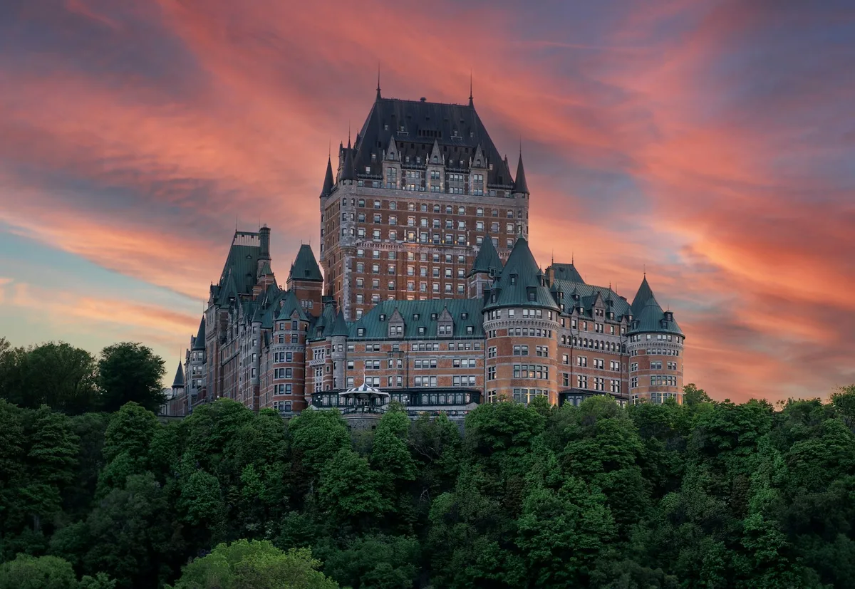 Fairmont Le Château Frontenac rising above Old Québec at sunset