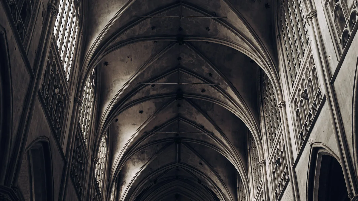 The ornate interior of a historic cathedral with high arched ceilings