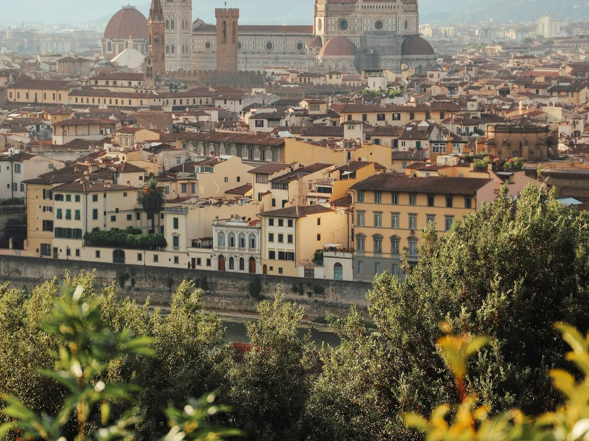 Florence's Duomo dome rising above the city's terracotta rooftops