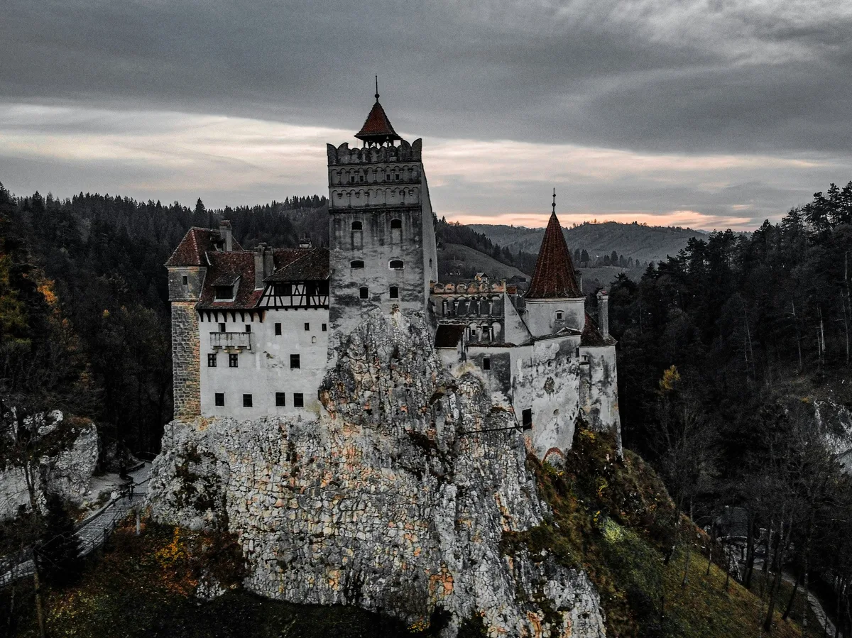 Bran Castle rising above the trees in Transylvania, Romania